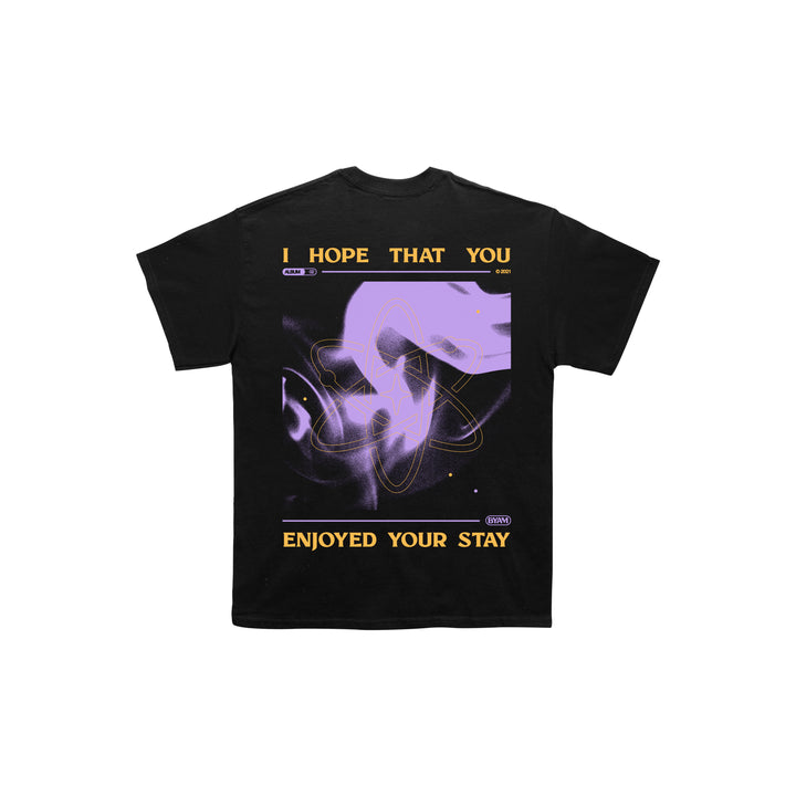 An exclusive Between You And Me design on a Next Level Black Tee, featuring yellow I HOPE THAT YOU ENJOYED YOUR STAY text on the front and a bold abstract purple graphic on the back—prints on both sides for standout style.