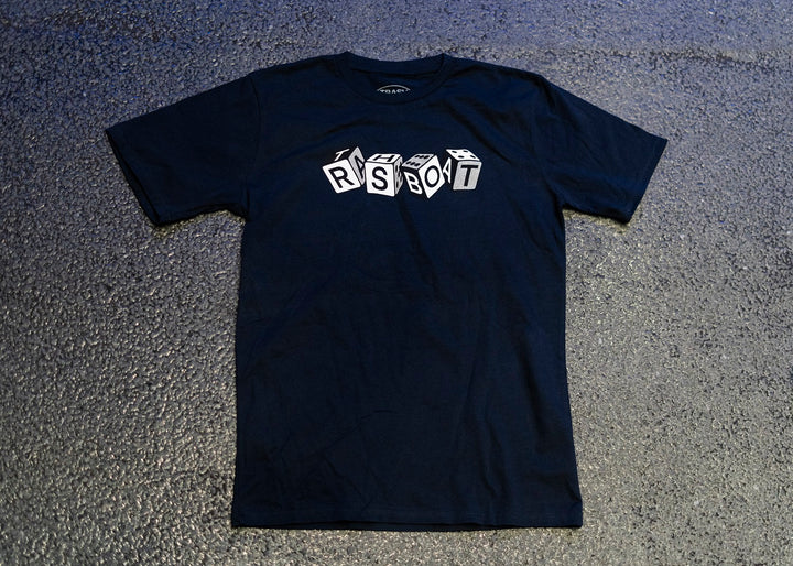 A black Trash Boat T-shirt laid flat on a textured surface, featuring RSBOT in white 3D-style block letters—a perfect piece of band merch for fans.