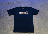 A black Trash Boat Band Merch t-shirt rests on a textured gray surface. The shirt displays RSBOT in block letters, each on a white 3D cube, reflecting the signature style of the Dice Navy T-shirt.