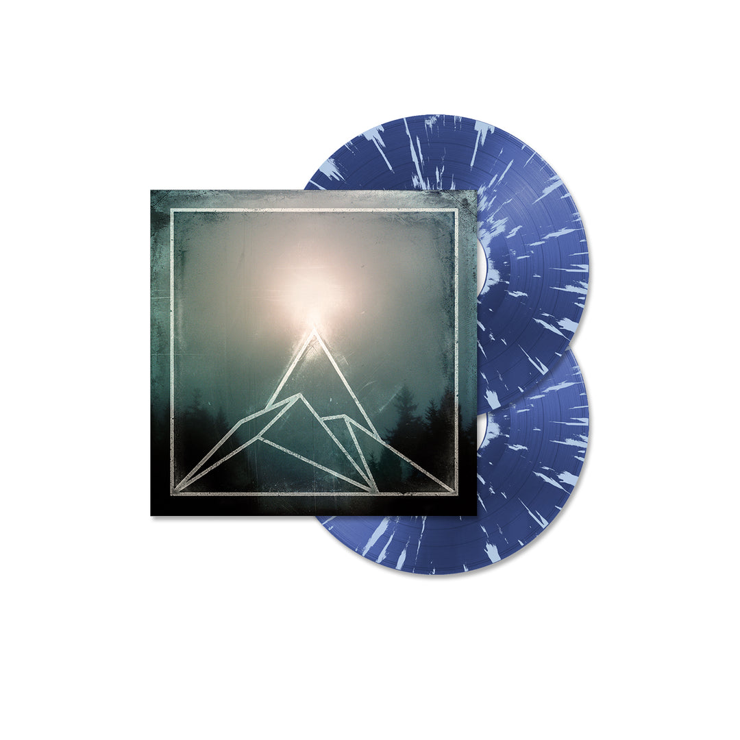 A double vinyl album by The Used with Canyon Transparent Blue and Light Blue Splatter records. The cover features a geometric mountain, glowing light source, misty forest backdrop, and a detailed tracklisting.