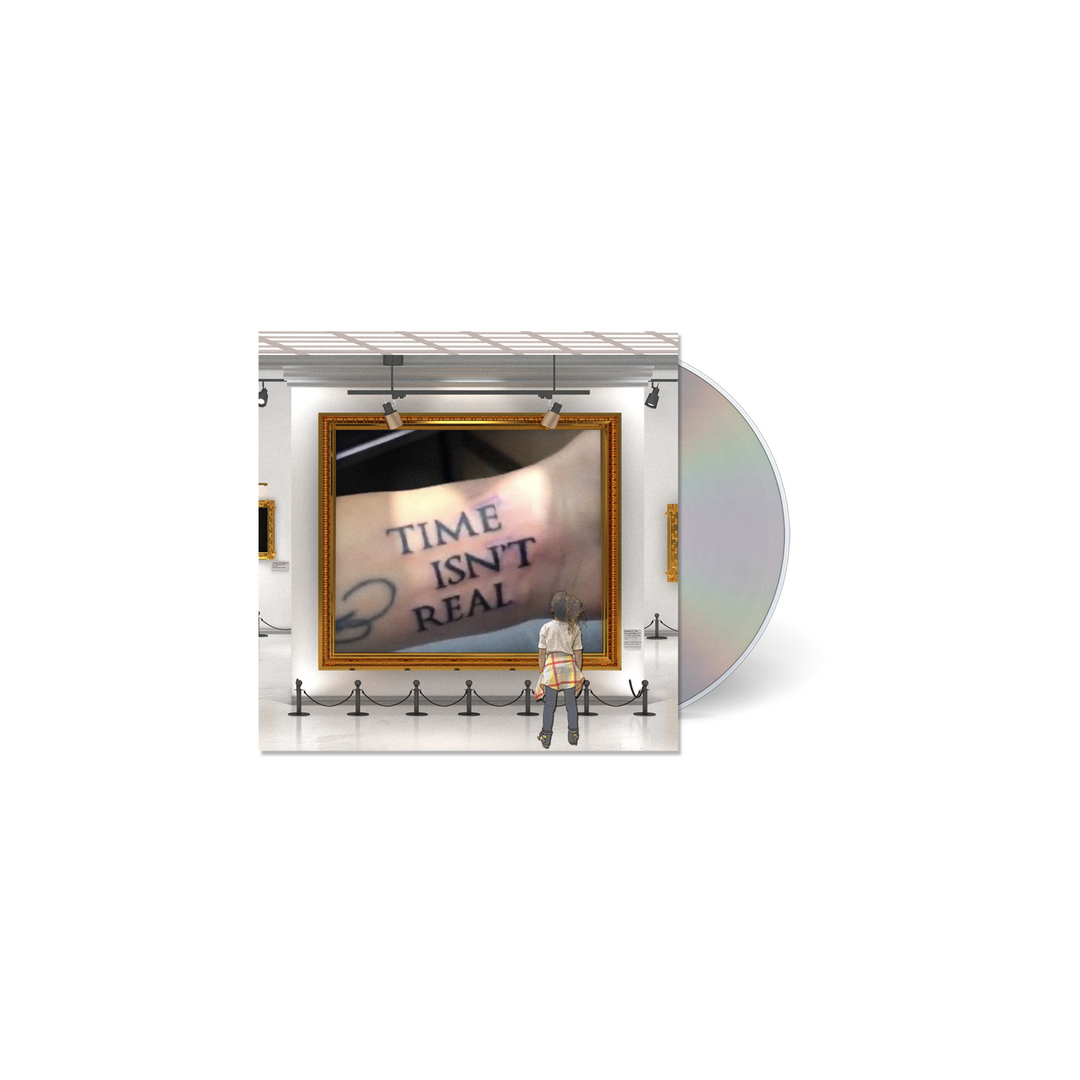 Grabbitz "Time Isn't Real" CD album cover. Image depicts an art gallery with someone looking at a painting of someone having the text Time Isn't Real tattooed on their wrist. 