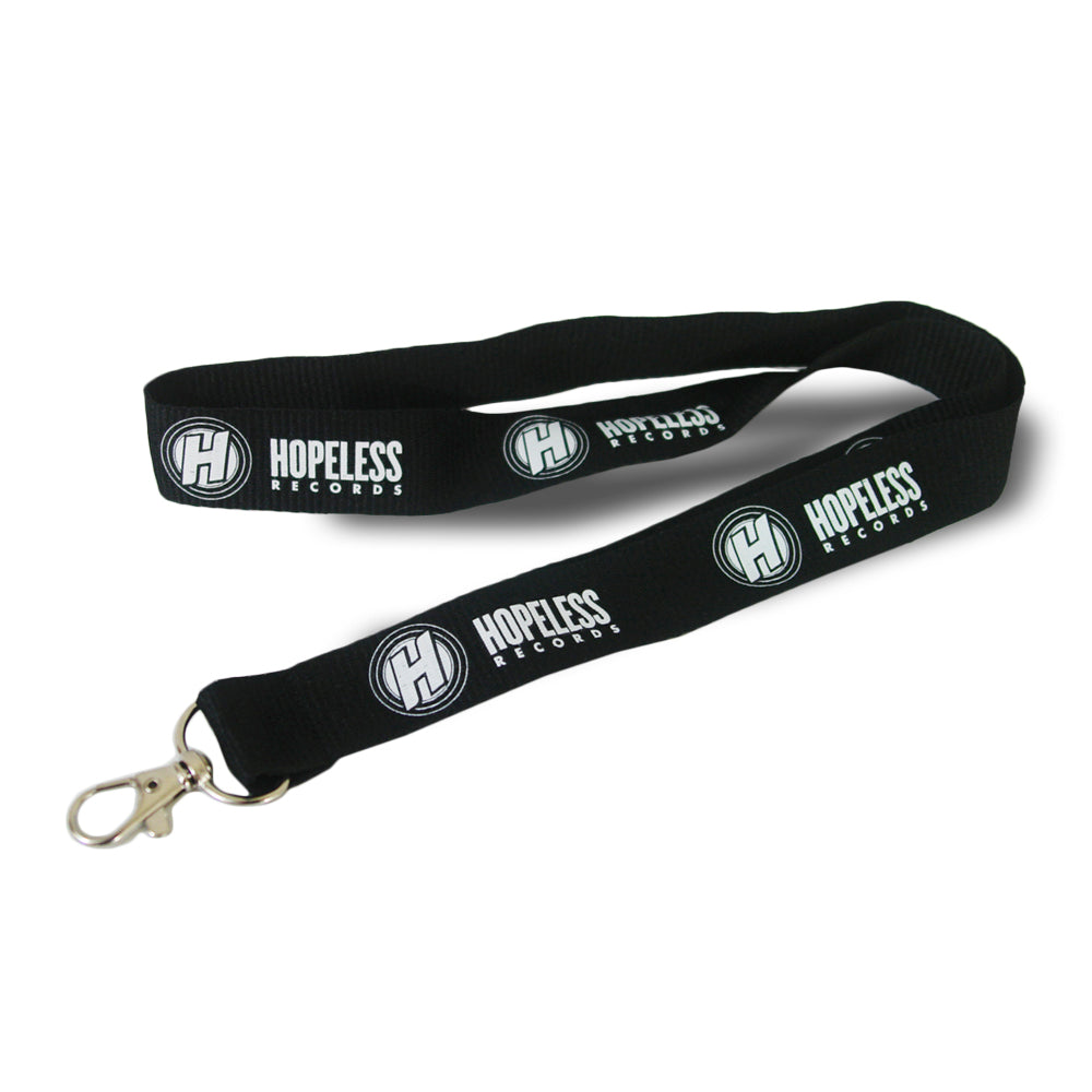 A black Hopeless Records lanyard with a silver clasp, featuring the logo and text printed in white along the fabric—ideal for holding your ID badge.