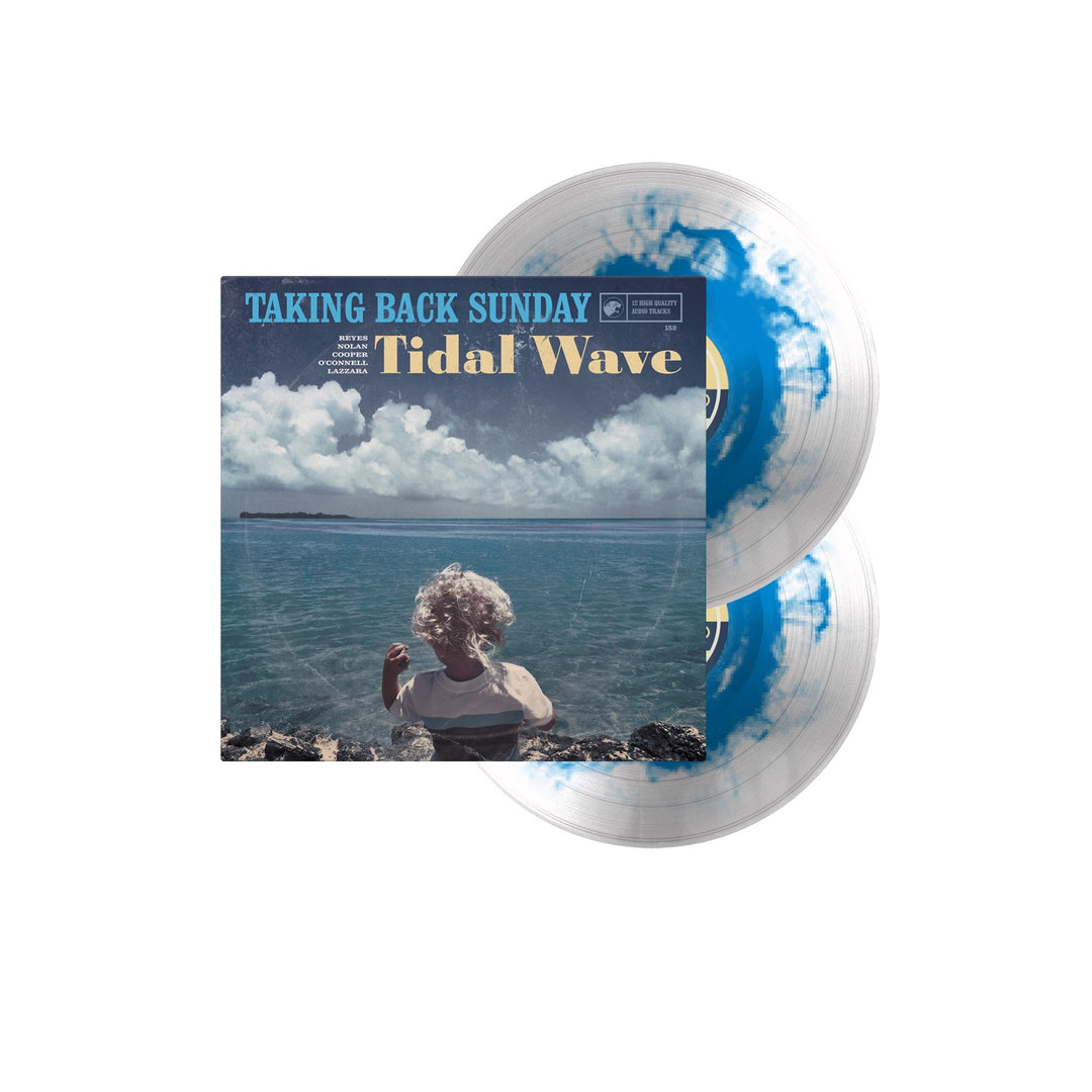 Taking Back Sundays Tidal Wave album is displayed on a transparent blue and white splatter 2XLP vinyl. The cover shows a person in the ocean under a partly cloudy sky, with two vinyl records partially visible behind it.