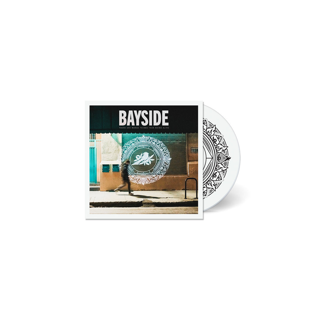 Bayside album cover shows a person walking past a wall with a bold white circle design, capturing an edgy vibe. BAYSIDE is at the top, and the Bayside CD with the same pattern is partially visible behind the cover.