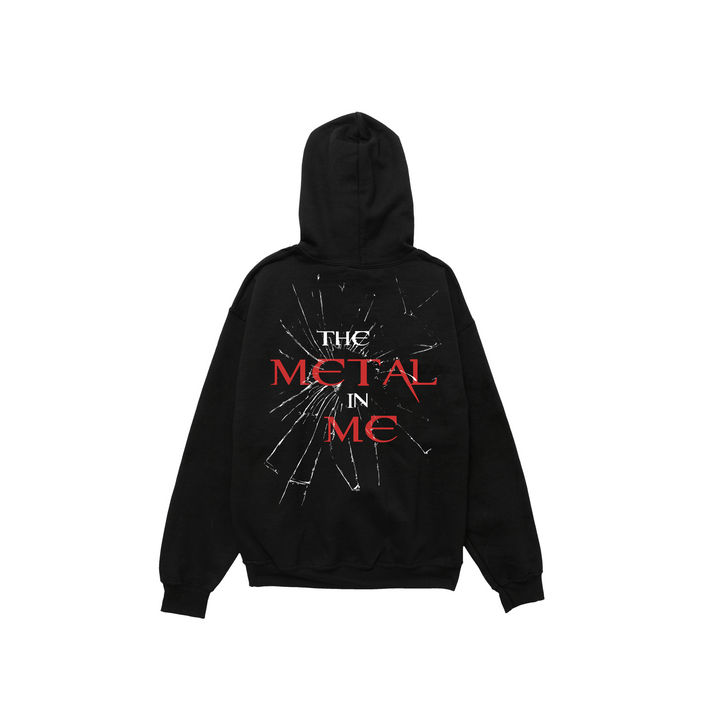 Black pullover on a white background. Back print says THE METAL IN ME with glass shatter effect.