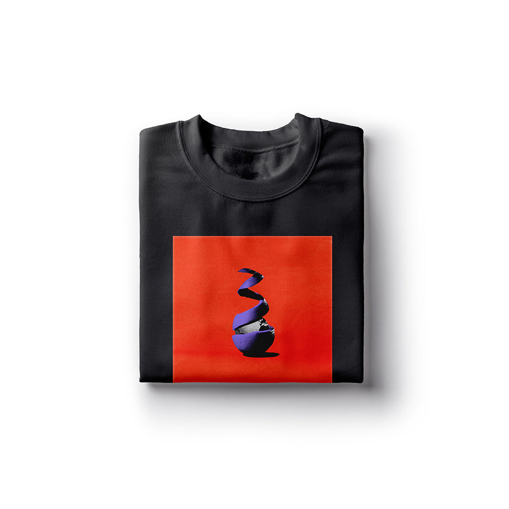 A folded black Neck Deep t-shirt displays a bold red square with a stylized purple and black spiral design in the center. Made from 100% cotton, the shirt is neatly arranged on a plain white background.