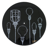 A black circular item from Dryjackets Lights Locks & Faucets collection features white line drawings of six uniquely designed light bulbs arranged vertically across its surface.