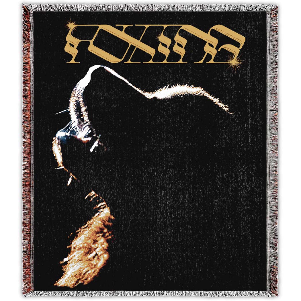 Artwork from Go Down Together woven design -50” x 60” blanket. FOXING text above a faded image of a dog howling. 