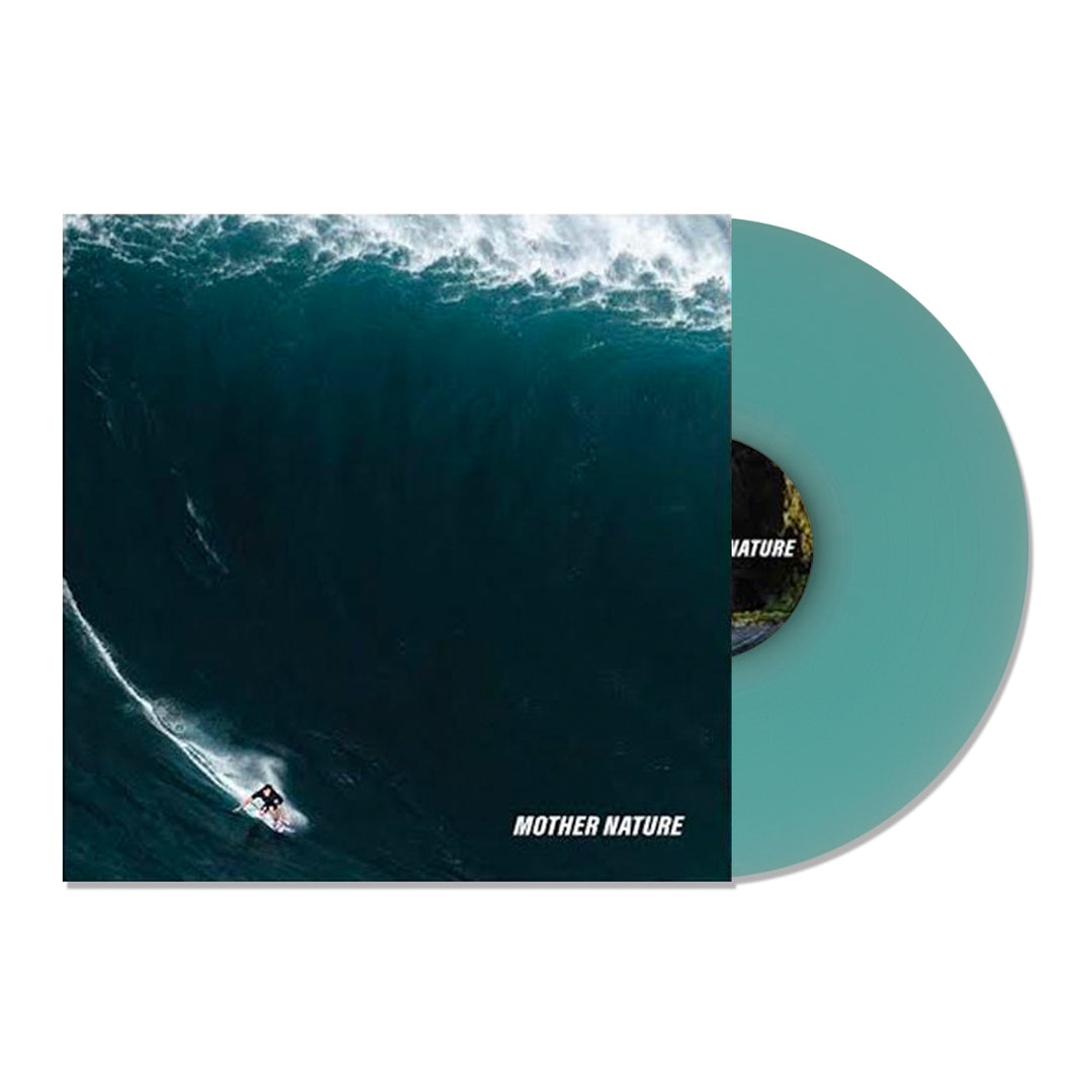 A limited edition teal vinyl record by The Dangerous Summer partially slides out of its cover, which shows a surfer riding a massive blue wave. MOTHER NATURE appears in white text at the bottom right of the cover.