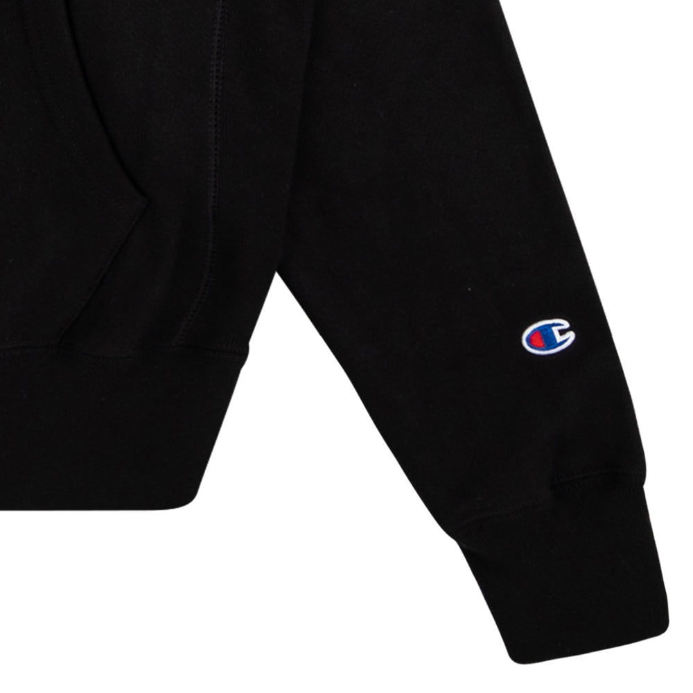 Black 100% cotton Neck Deep hoodie featuring the right sleeve with a small embroidered Champion logo near the cuff and part of a front pocket visible; classic Sonderland style.