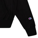 Black 100% cotton Neck Deep hoodie featuring the right sleeve with a small embroidered Champion logo near the cuff and part of a front pocket visible; classic Sonderland style.